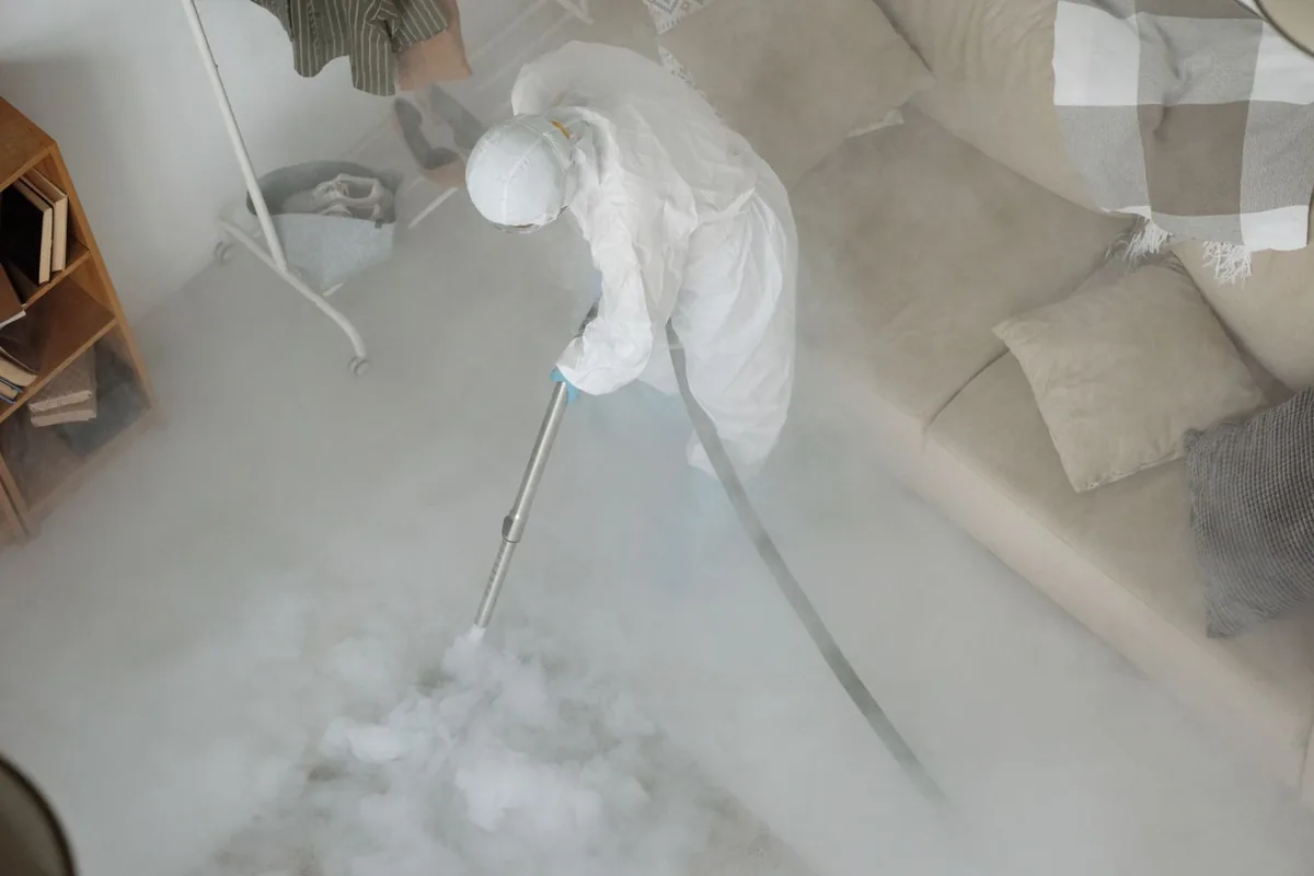 Biohazard cleanup technician in protective equipment, East Bethel, MN